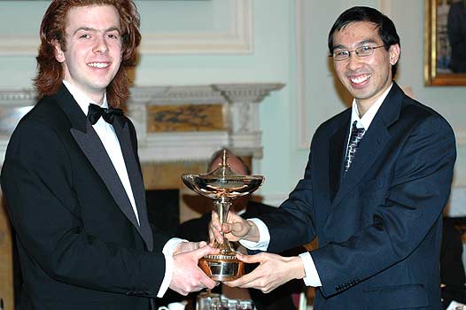 Glory is shared: Oxford captain Steffen Schaper and Cambridge non-playing captain Richard Lee hold up the trophy